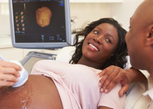 Pregnant woman getting ultrasound