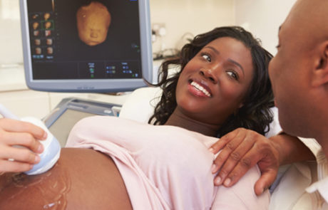 Pregnant woman getting ultrasound