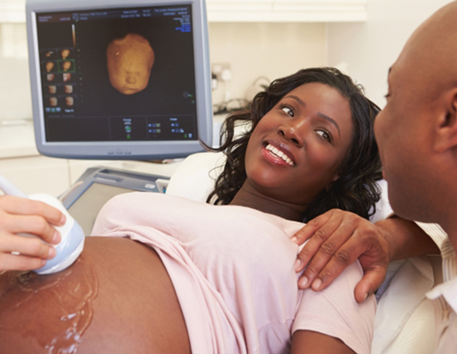 Pregnant woman getting ultrasound