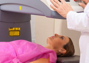 Woman undergoing DEXA bone density scan