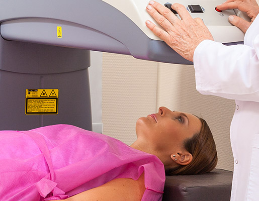 Woman undergoing DEXA bone density scan