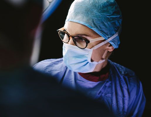 surgeon wearing a mask and glasses