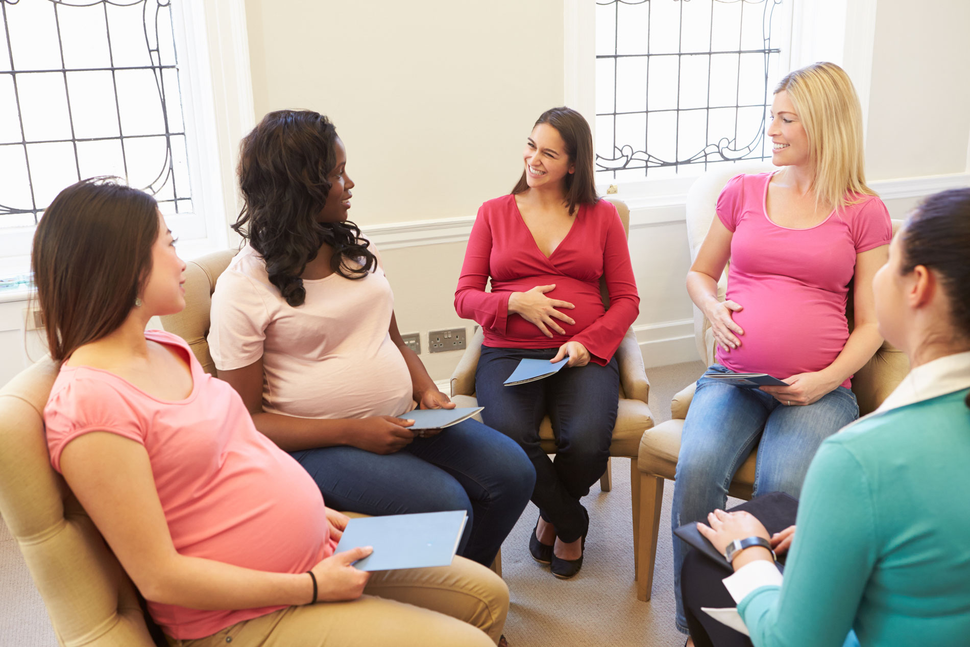 Pregnant women sitting in a group prenatal class